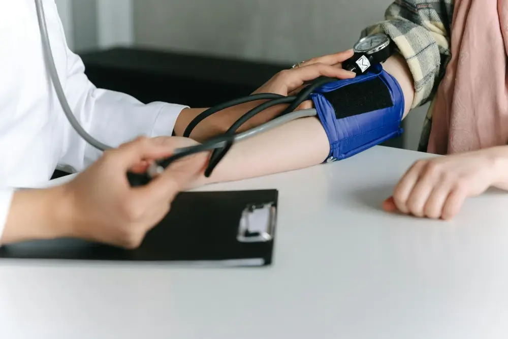 picture of a doctor taking blood pressure of someone